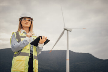 A dedicated female engineer oversees complex wind farm operations, showcasing her expertise and...
