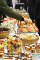 catering buffet with variety of food snacks and appetizers.