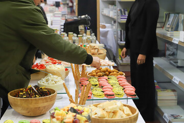 catering buffet with variety of food snacks and appetizers.