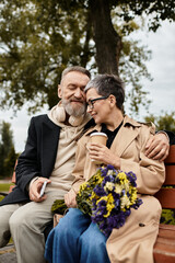 Mature couple sharing a warm moment with flowers in a peaceful park setting