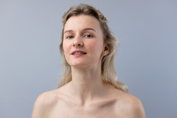 A Portrait of Natural Beauty: Capturing the Essence of a Woman with Soft Features and a Confident...