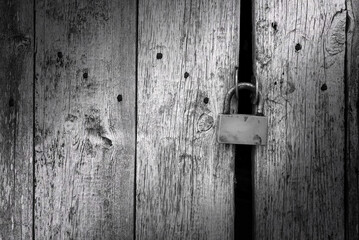 Old rusty lock on metal doors. Lock on the door with an empty place for an inscription