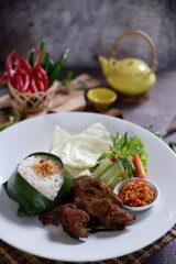 Nasi Bebek Goreng, fried duck served with rice chili sauce (sambal), tomato and cucumber 2