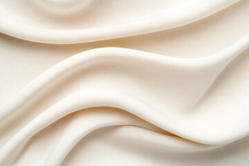 Obraz premium Soft cream fabric draped elegantly to showcase its smooth texture and gentle folds in natural light