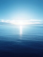 Obraz premium Tranquil Ocean Horizon at Sunrise Reflecting Calm Waters and a Clear Blue Sky Creating a Serene Atmosphere for Peaceful Coastal Imagery