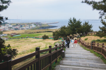 Jeju-do, Seongsan Ilchulbong  landscape, volcanic tuff cone, Sunrise peak, Jeju Island, South Korea, Seongsan-ri, Seogwipo, Jeju Province landscape view in a sunny day, with sea, cliffs hiking trail