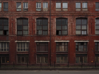  Red facade of an old brick industrial building