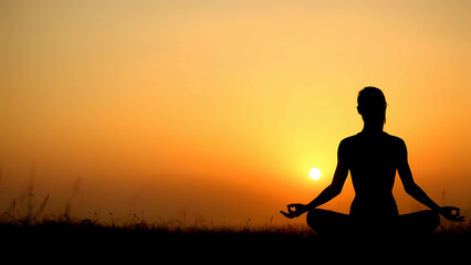 Silhouette of a person sitting on a mountain peak, gazing at the horizon, sense of adventure