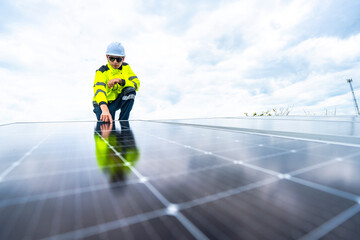 Fototapeta na wymiar A skilled technician adjusts a solar panel on rooftop, emphasizing the transition to sustainable energy. Equipped with safety gear, the worker demonstrates precision in renewable energy installations.