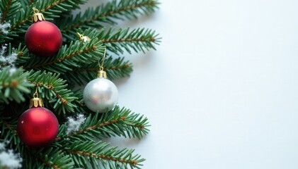 Evergreen branches with ornaments on a snowy white background, holiday, Christmas decorations