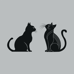 Two Black Cats Sitting