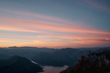 Sunset sky over a mountain range by the bay