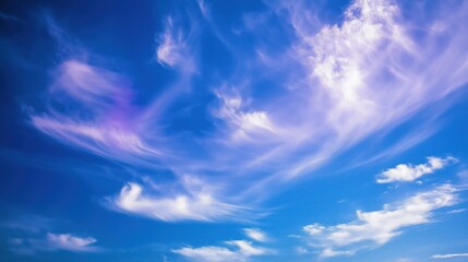 Obraz premium A stunning view of a clear blue sky filled with soft, wispy clouds.