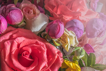 Floral background of roses of different colors.Selective soft focus, blurred background with copy space.