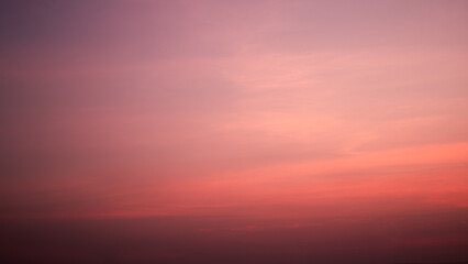 Calm sky in winter evening, Background image of sky gradient with beautiful pastel pink and orange and purple in the evening as the sun sets, Atmosphere of the twilight sky was calmin in evening.