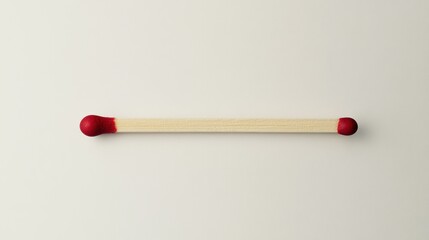 Single matchstick on white surface