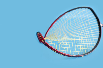 Badminton racket which is broken at the frame from playing by hittting and defending of the players.