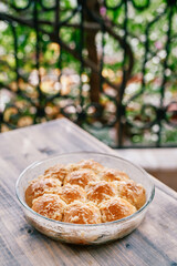 Dish with donuts with garlic stands on the table