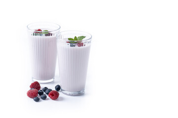 Fresh raspberry and blueberry smoothie isolated on white background. Copy space