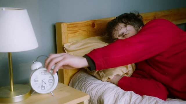 Man Struggling to Wake Up &ndash; Hitting Snooze on Alarm Clock