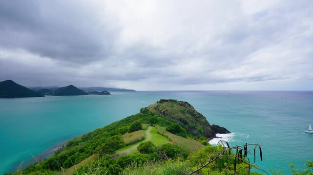 A wide-angle static video of Pigeon Island and Rodney Bay in St Lucia with a dramatic overcast sky above. 