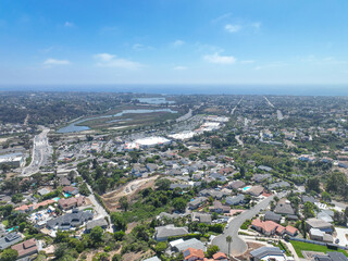 Aerial view of middle class houses in the valley of Oceanside town in San Diego, California. USA.