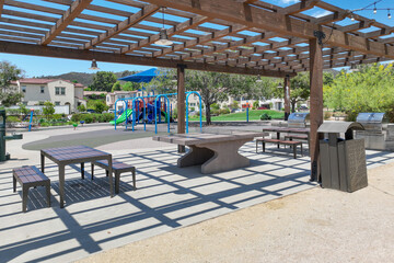 Covered gathering area in community park with picnic tables, Escondido, San Diego, California