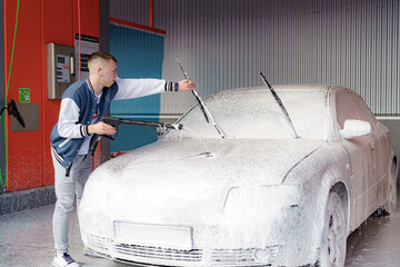 Car in foam at a pressure car wash.