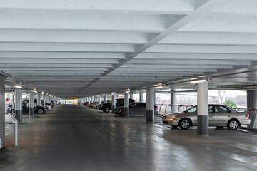 Underground parking with cars. Parking garage - interior shot of multi-story car park