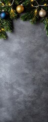 A festive arrangement of evergreen branches and ornaments, set against a textured gray background, perfect for holiday decorations.