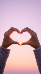 Fototapeta premium Woman hands heart shape lavender-pink glow