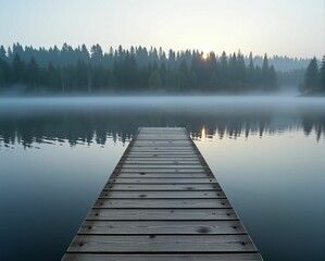 Fototapeta premium A serene wooden dock stretches into a misty lake, framed by tall trees and reflecting soft morning light, creating a peaceful natural scene.