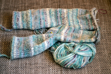 knitted socks made of wool yarn, handicraft concept, knit