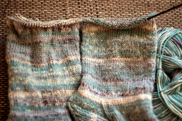 knitted socks made of wool yarn, handicraft concept, knit