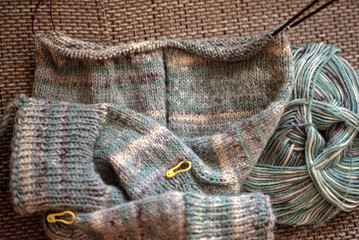 knitted socks made of wool yarn, handicraft concept, knit