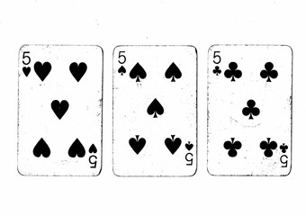 Vintage playing cards in black and white showing three of the same value.