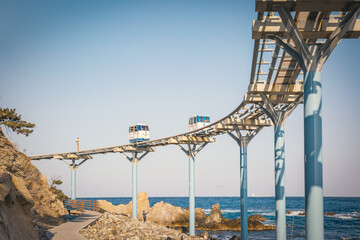Coastal Monorail on the Sea: a scenic trip along a beach track. Monorail trains at Jukbyeon Port, Uljin County, North Gyeongsang Province, South Korea.