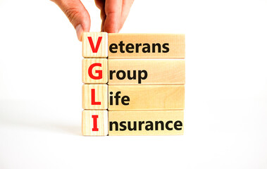 VGLI Veterans Group Life Insurance symbol. Concept word VGLI Veterans Group Life Insurance on blocks. Beautiful white background. Business VGLI Veterans Group Life Insurance concept. Copy space.