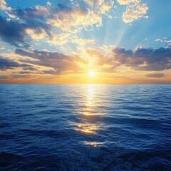 Obraz premium A breathtaking aerial view captures a stunning sunset over the tranquil ocean, where vibrant hues of orange, pink, and purple blend seamlessly into the horizon, reflecting on the water's surface.