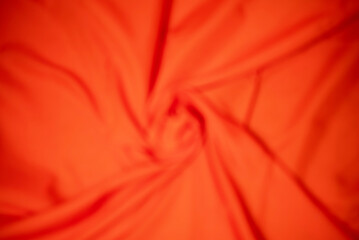 Blur plain orange color cloth background