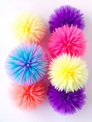 Fur colorful pompoms. Fluffy  ball  with furry texture. Rainbow holographic colors, pink and purple. Set off isolated objects on white background. Vector illustration.