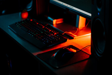 Exploring a vibrant gaming setup with neon accents and detailed equipment in an immersive online work environment