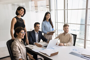 Successful business team. Portrait motivated multiethnic corporate employees group with middle aged...