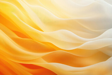 Fototapeta premium Abstract image of flowing, translucent fabric in warm, golden hues.