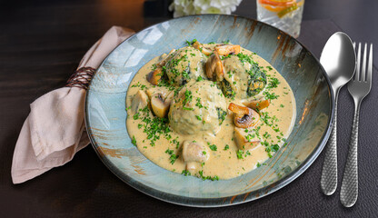 spinach dumplings in creamy mushroom sauce