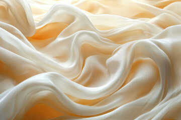 Obraz premium Creamy, soft silk fabric draped in elegant, flowing waves, showcasing its luxurious texture and subtle sheen.