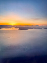 Sunrise Over the Ocean With Islands in the Distance