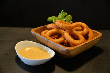 deep fried onion rings with sauce
