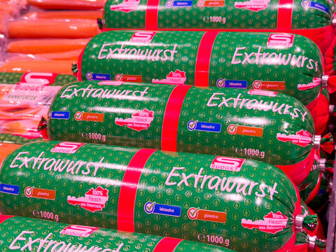 Assortment of extrawurst sausages in colorful packaging display