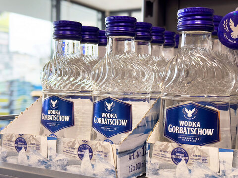 Wodka gorbatschow bottles on store shelf with blue caps and labeling design